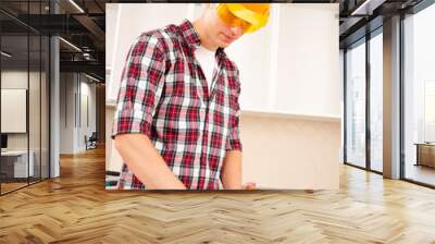 worker makes marks Wall mural