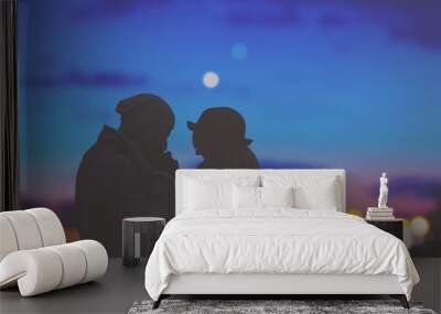 Couple in love with de-focused city lights in the background. Wall mural