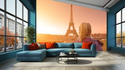 lonesome girl watching at paris city scape at sunset/sunrise. Wall mural