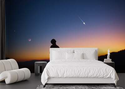 Man looking at the night sky, stars, planets, Moon and shooting stars. Wall mural