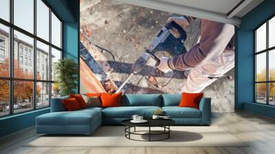 Real construction worker working on a house renovation - authentic person on the job. Wall mural