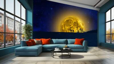 Silhouettes of two man watching the moonrise. Wall mural