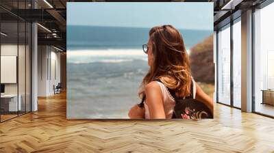 Woman enjoying tropical beach view. Wall mural