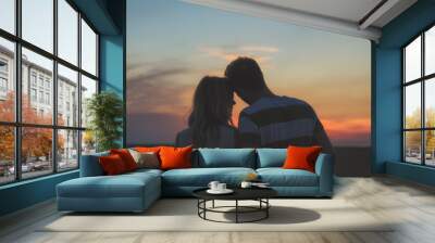 Young couple enjoying outdoors in the field. Wall mural