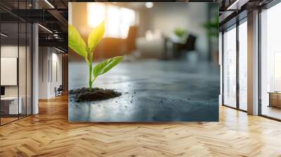 Green seedling through concrete business innovation sustainability Wall mural