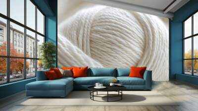 A close-up shot of a white yarn ball. This photo is perfect for projects related to crafts, knitting, and textiles. Wall mural