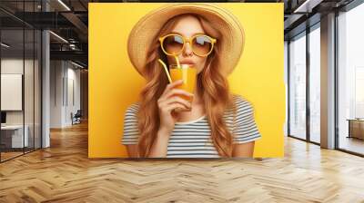 Woman drinks juice with a straw. This image is perfect for advertising summer drinks, refreshments, or healthy living. Wall mural