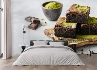 Tasty healthy food green tea matcha and chocolate brownie of dessert white background. AI generated Wall mural