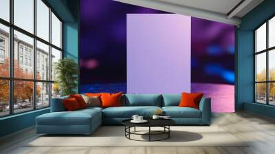 Blank white box mockup on a reflective surface with purple and blue neon lights in the background. Wall mural