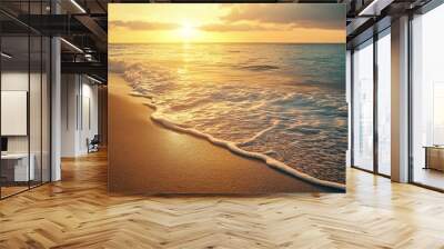 Golden sunset over the ocean with waves crashing on the sandy beach Wall mural