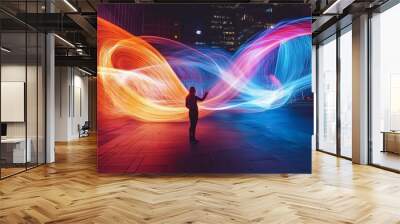 Silhouette of woman standing between glowing light streaks in a city, futuristic concept of technology and connection Wall mural