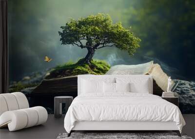 Tree growing from open book, nature fantasy concept Wall mural