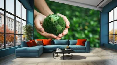 Hand holding of green earth ball, forest background, Earth Day, Environment society and governance sustainable environmental concept Wall mural