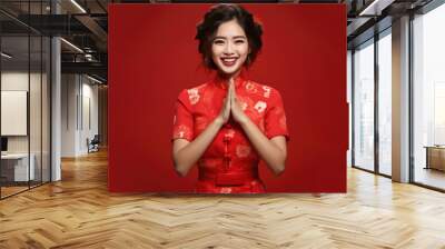 Happy Chinese New Year , Asian woman wearing traditional cheongsam qipao dress on red background Wall mural