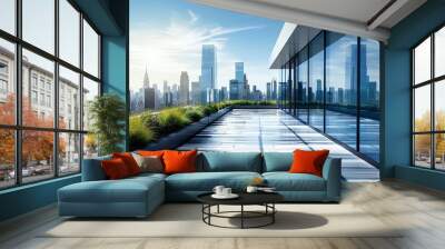 Modern urban rooftop terrace with a stunning skyline view and reflective glass windows under a bright blue sky. Wall mural