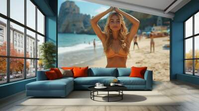 Young Woman Practicing Yoga on Sunny Beach in Orange Bikini, Relaxing Summer Day Wall mural