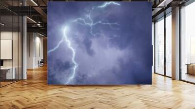 Strong eletric lightning lines in high black clouds Wall mural