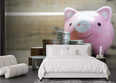 Piggy save with coins stack on wood background Wall mural