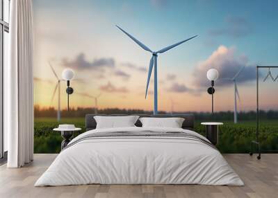 Wind turbines standing tall in a green field during sunset, highlighting renewable energy and sustainability against a vibrant sky. Wall mural