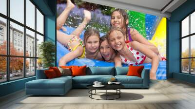 happy girls in the inflatable pool Wall mural