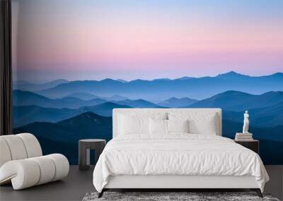 The image shows a beautiful mountain landscape with a vibrant sky full of color. Wall mural