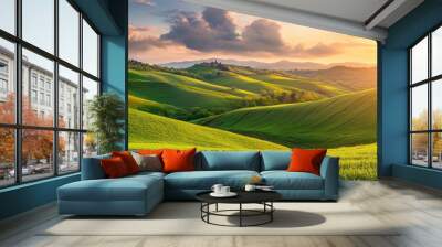 Green spring hills with young grass and amazing growing fields and hills with beautiful bright cloudy sunset on background of rural landscape Wall mural