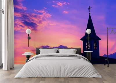 Heavenly religious church chapel steeple in silhouette against a azure blue purple cloudscape sky Wall mural