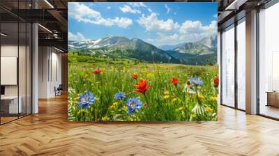 A field of flowers with mountains in the background Wall mural