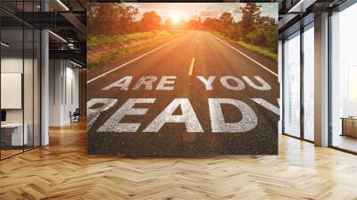 Are you ready written on highway road in the middle of empty asphalt road at  beautiful blue sky. Wall mural