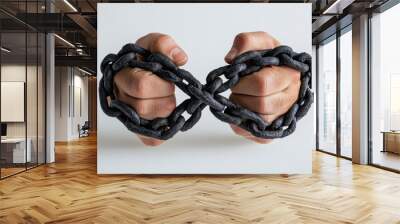 Close-up of hands tightly bound together by heavy metal chains, symbolizing restriction, bondage, and lack of freedom. Wall mural