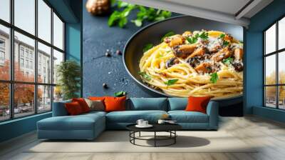 Delicious plate of spaghetti with mushrooms, garnished with parsley and Parmesan cheese, on a dark rustic background. Wall mural