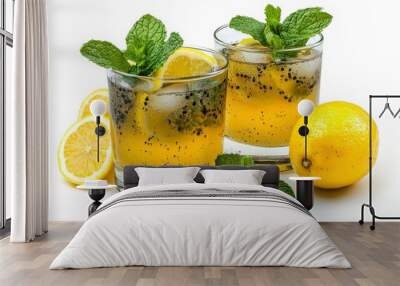 Fresh lemon drink garnished with mint, served over ice in clear glasses, perfect for a refreshing summer beverage. Wall mural