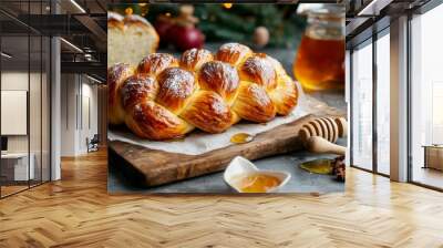 Freshly baked bread loaf with honey, apples, and festive decorations for a cozy holiday atmosphere. Wall mural