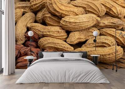 Pile of Tiger peanuts on wooden background Wall mural