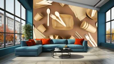 A set of disposable tableware and wood cutlery on brown background. Fast food containers. Eco-conservation concept. Flat lay Wall mural