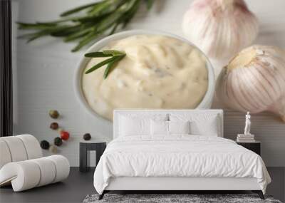 Bowl of garlic sauce, ingredients on white background, space for text. Top view Wall mural