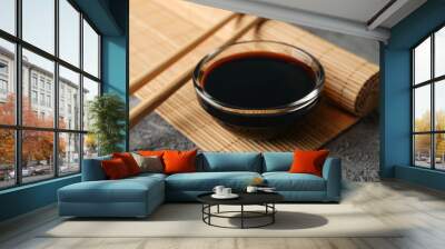 Bowl of soy sauce on gray background, space for text. Closeup Wall mural