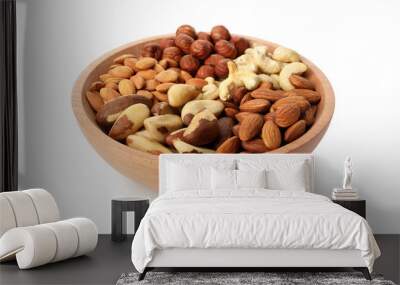 Bowl with different nuts isolated on white background Wall mural