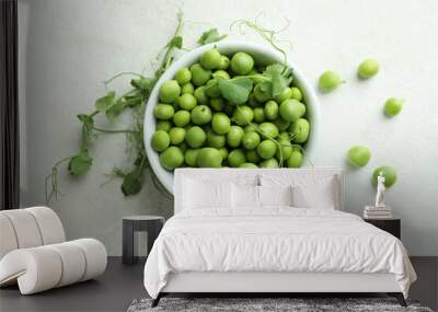 Bowl with pea seeds on white textured background Wall mural