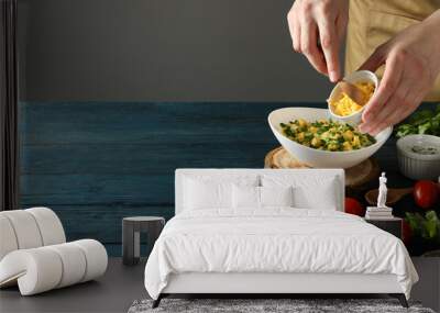 Cheese soup in a bowl with tomatoes on the table Wall mural