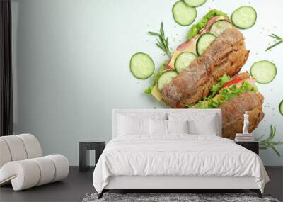 Ciabatta sandwiches and ingredients on white background Wall mural