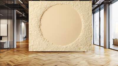 Circle made of rice on beige background, space for text Wall mural