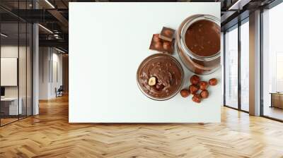 Concept of delicious food with chocolate paste on white background Wall mural