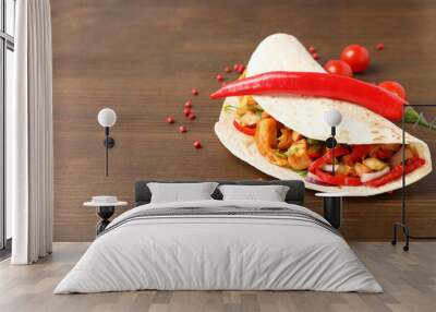 Concept of tasty food with taco on wooden background Wall mural