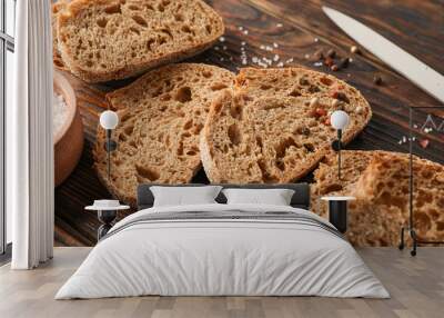 Flat lay composition with freshly baked bread on wooden background, closeup and space for text Wall mural