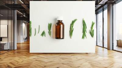 Flat lay composition with rosemary oil and leaves on white background, space for text Wall mural