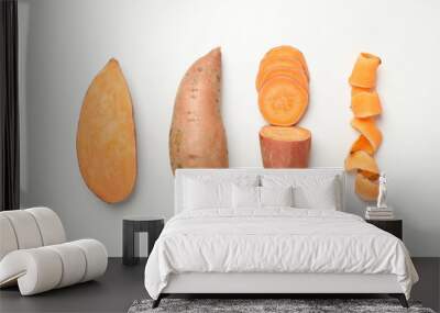 Flat lay with sweet potato on white background, top view Wall mural