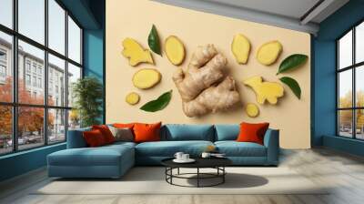 Fresh ginger and leaves on beige background Wall mural