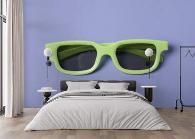 Green glasses with tinted lenses on purple background Wall mural