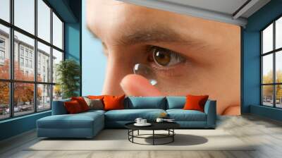 Installation of a contact lens in the eye close-up Wall mural